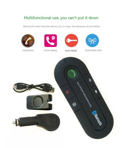Black Bluetooth hands-free car kit mounted on a car sun visor with charger and cable.