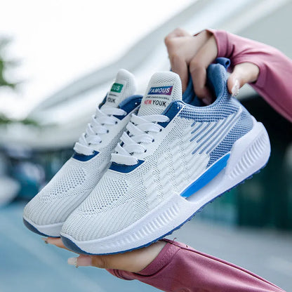 Men's blue mesh casual shoes with round toe and plastic sole on a white background.