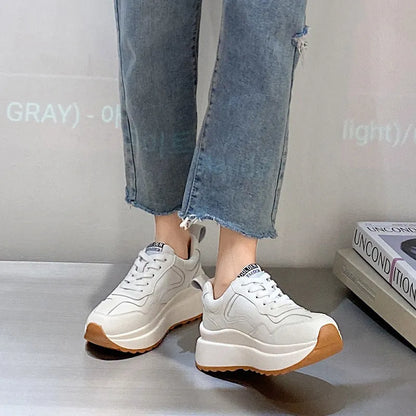 Beige women's low-top casual sports shoes made from cattlehide leather with round toe and front lace-up.