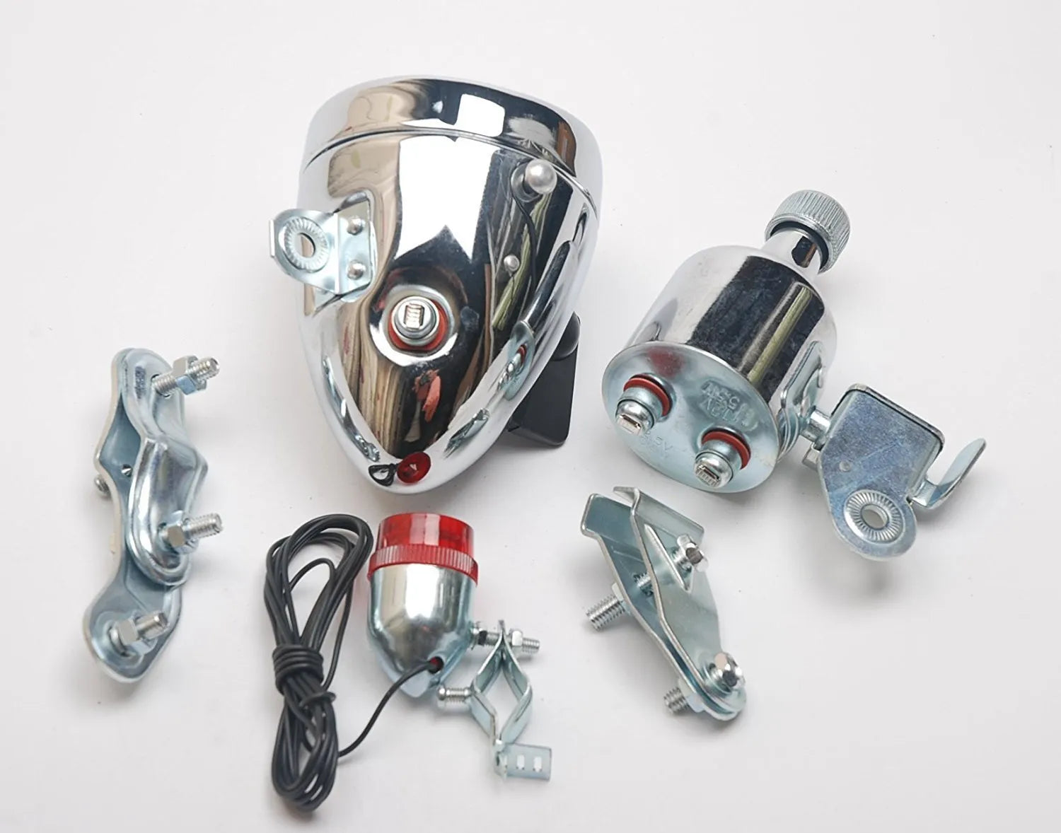 Silver dynamo-powered bicycle light set with generator unit for friction drive on wheel.