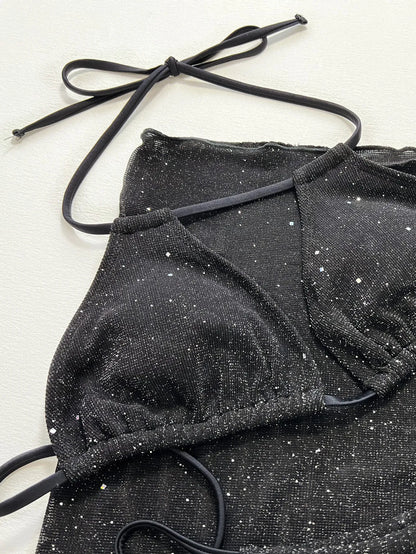 Black three-piece fission style swimsuit bikini set with top and shorts on a mannequin.