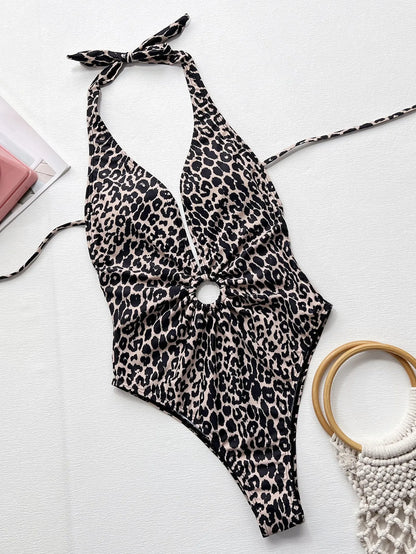 Leopard print women's one-piece swimsuit with hollow-out ring design on a mannequin.
