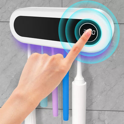 Wall mounted toothbrush holder with UV sterilizer and toothpaste dispenser in ivory white