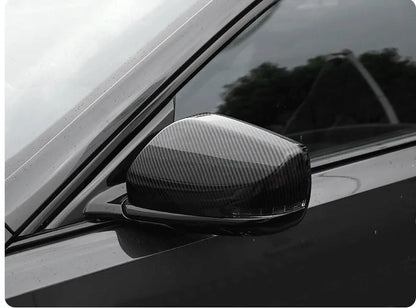 Pair of ABS plastic mirror covers for Cadillac CT5 CT6 in carbon fibre, silver, and rain frame finishes.