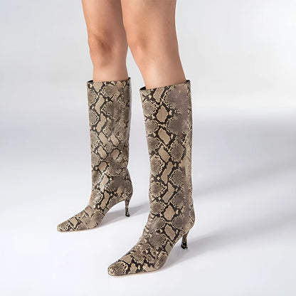 A pair of women's black square-toe cowboy boots made from microfiber leather.