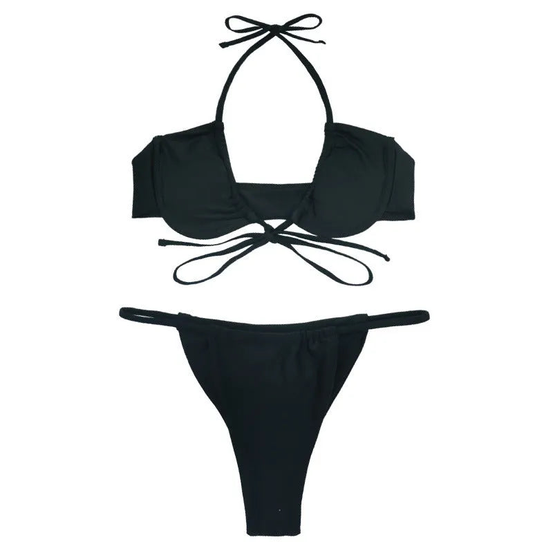 Women's black and mint green split-style bikini swimsuit made from nylon fabric.