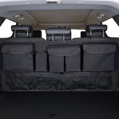 Black car hanging storage bag made of waterproof Oxford cloth with a handle, shown hanging in a vehicle boot.