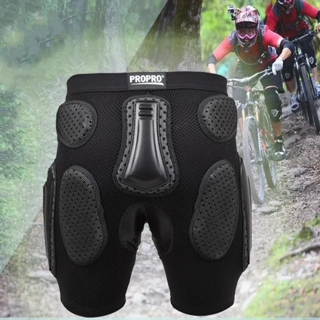 Black cycling hip protection pants shown laid flat, designed for impact safety during sports.