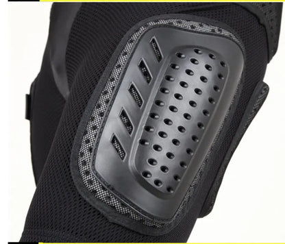 Black cycling hip protection pants shown laid flat, designed for impact safety during sports.