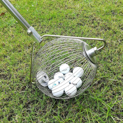 Metallic coloured stainless steel golf ball picker on a green surface.