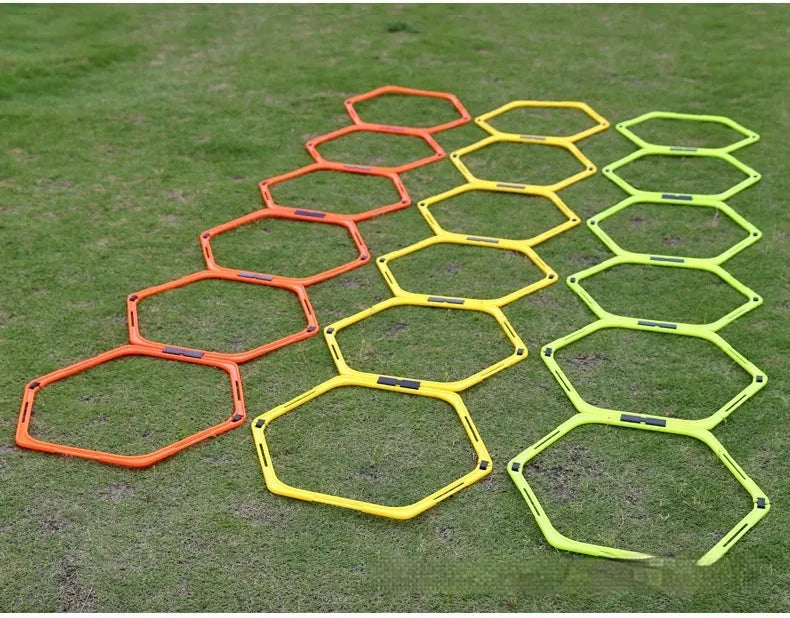 Set of six foldable hexagon football training rings in yellow, green and orange colours