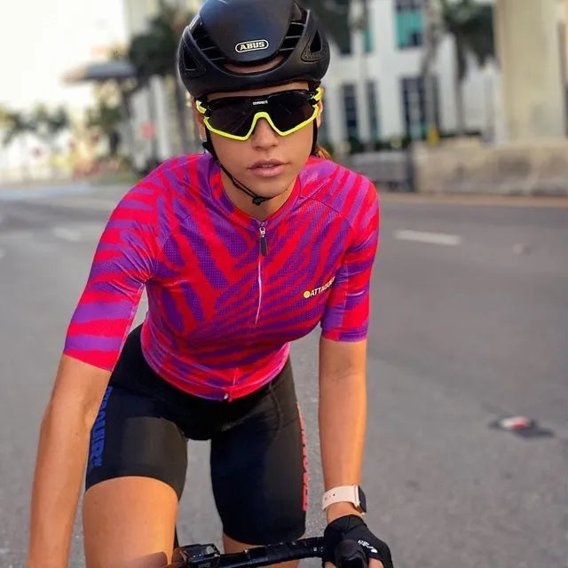 Attaquer women's kaleidoscope-pattern cycling jersey and pants set on a model.