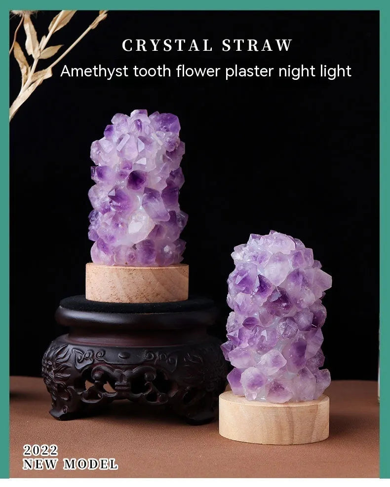 Mini USB night light glowing inside a natural amethyst crystal vug geode on a dark surface.