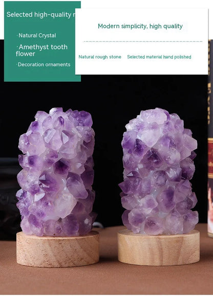 Mini USB night light glowing inside a natural amethyst crystal vug geode on a dark surface.