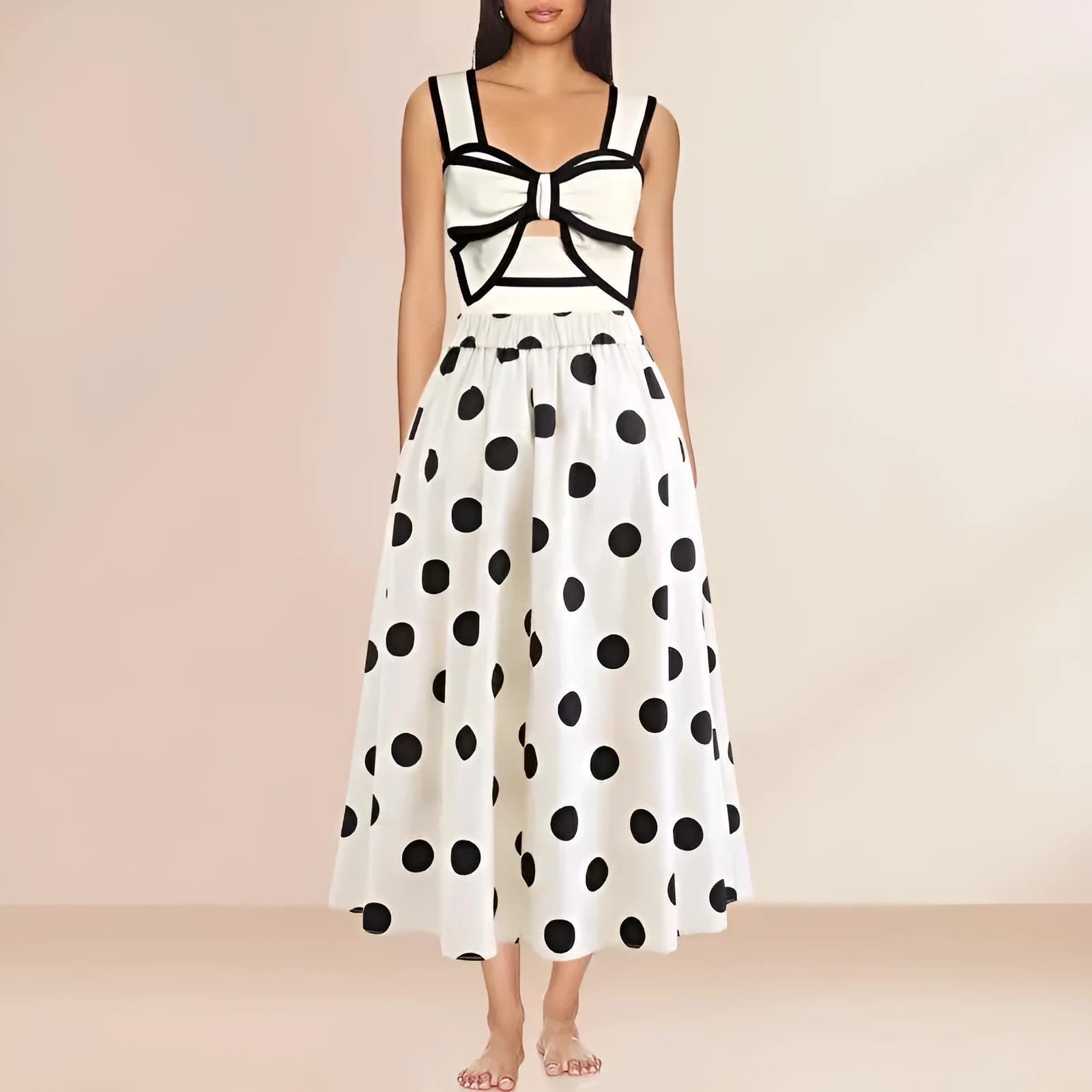 Women's black one-piece swimsuit with white attached round skirt and decorative bow at front
