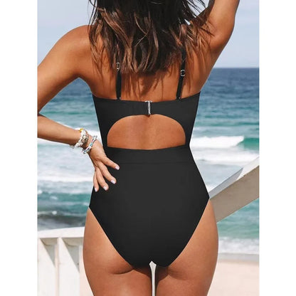 Women's black cross-back one-piece swimsuit with backless design on mannequin