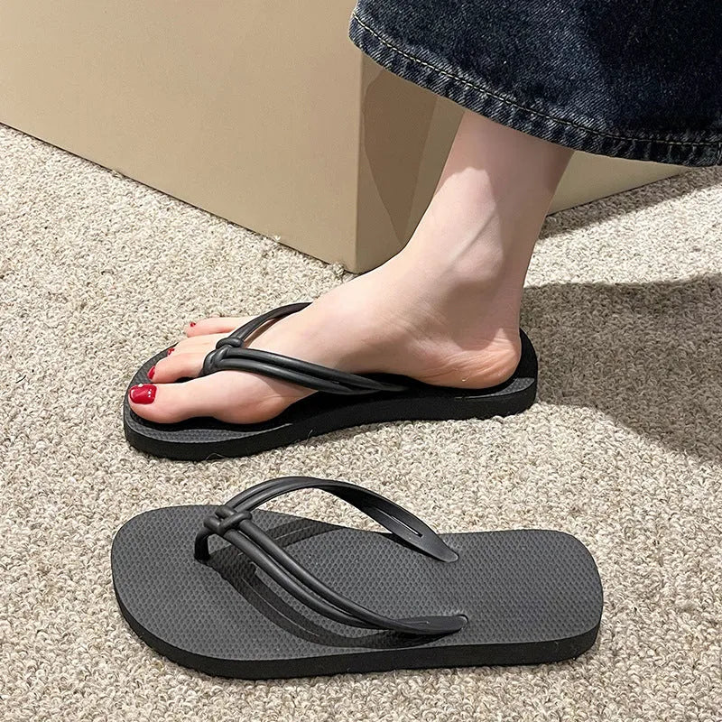 Men's PVC toe-covering flip-flop slippers on a white background, showing the injection moulded sole and available colour options.