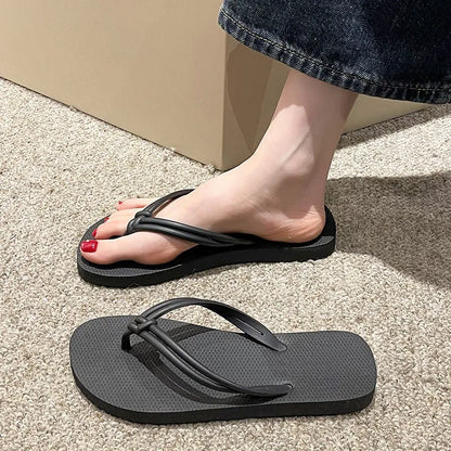 Men's PVC toe-covering flip-flop slippers on a white background, showing the injection moulded sole and available colour options.