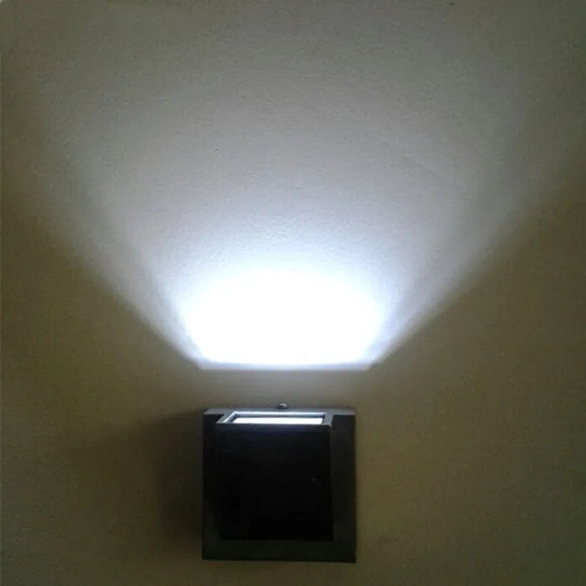 Black 5W waterproof LED wall lamp with glass lampshade, 80 x 80 x 60 mm, for courtyard wall or hotel room