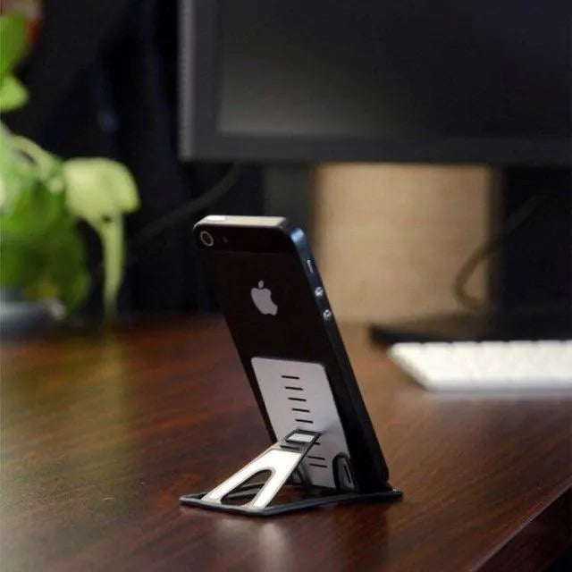 Card phone holder with lazy bracket design in matte black finish measuring 8.5cm by 5cm for desktop use, compatible with general smartphones and mobile devices, a compact stand for hands-free viewing and charging organisation