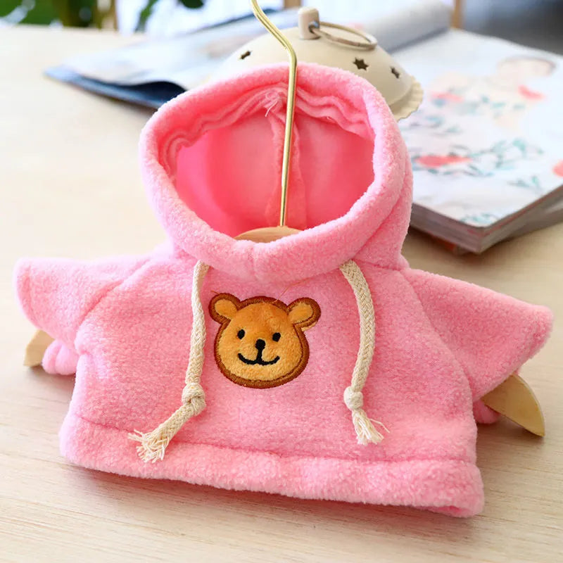 Cloth dog hoodie sweater in blue, shown in medium 23cm size on a small dog.