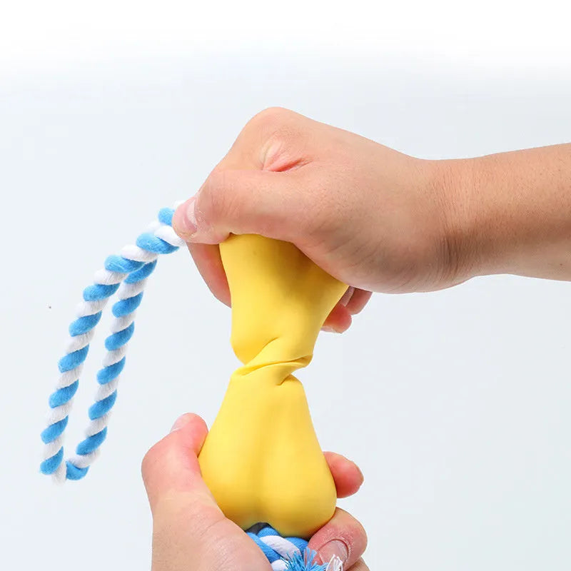 Green porous bone dog toy with knotted rope, hollow for treats, measuring 138mm