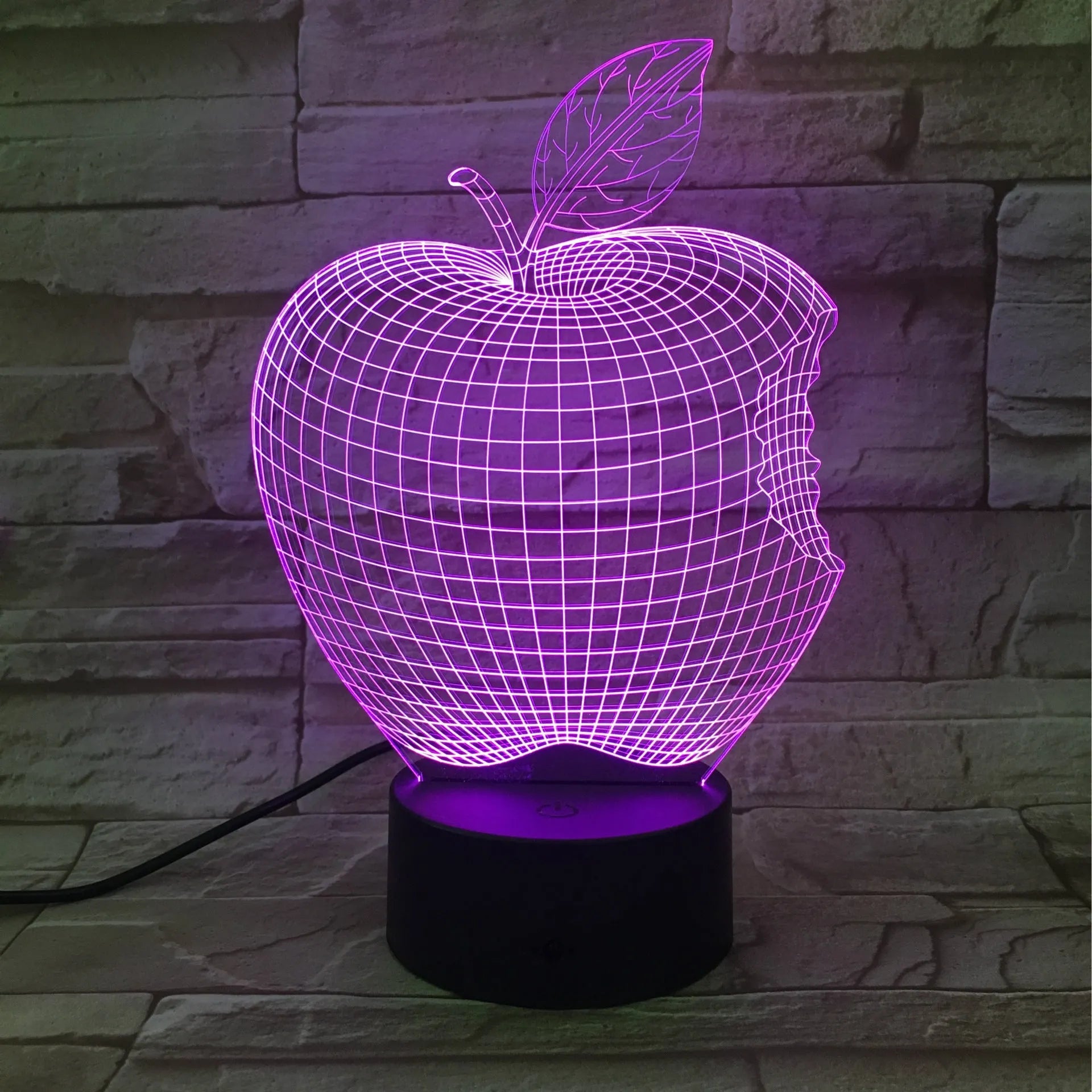 Colourful 3D fruit design LED night light with touch control on a table.