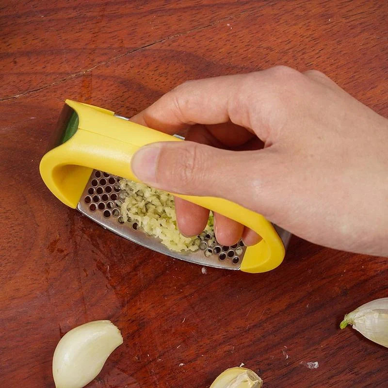 Stainless steel garlic press with non-slip handle for easy crushing