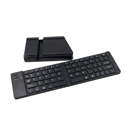 Compact, foldable Bluetooth wireless keyboard with a sleek, minimalist design for use with UK mobile devices