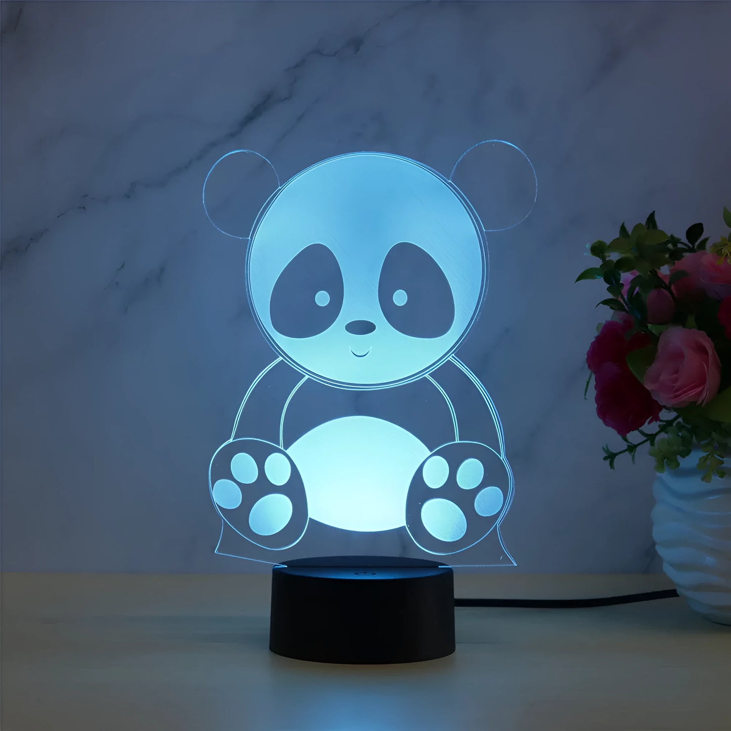 Panda night light with remote control showing seven colour options including red, green, blue, yellow, purple, and white LEDs