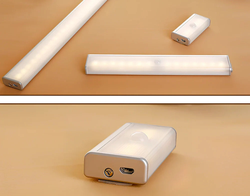 Wireless LED wardrobe light in 300mm size with motion sensor and charging pad, warm white glow, mounted on shelf