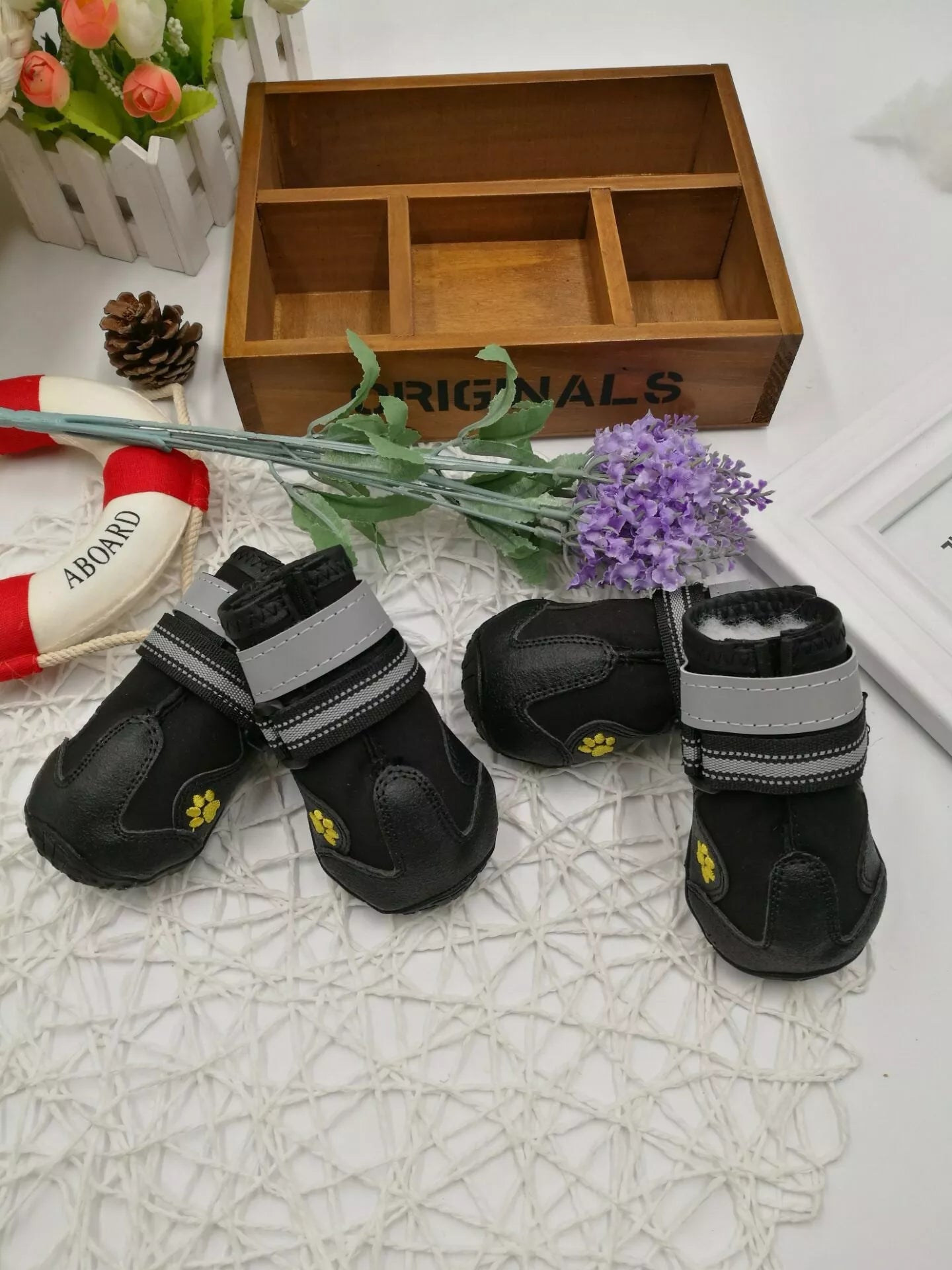 Black waterproof dog shoes with non-slip soles and adjustable fuzzy belt