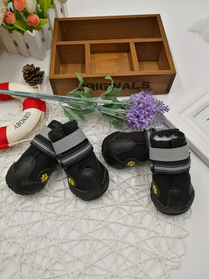 Black waterproof dog shoes with non-slip soles and adjustable fuzzy belt