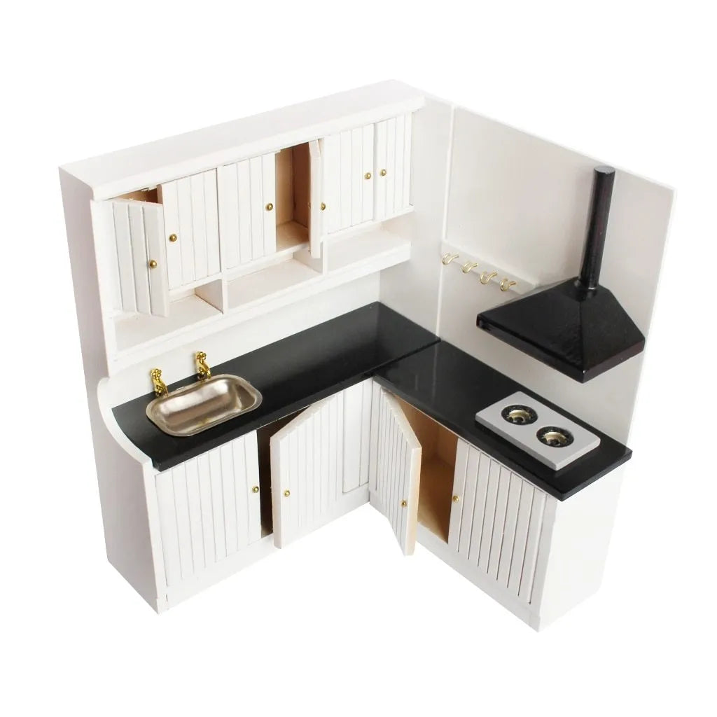 White dollhouse kitchen sink and stove cabinets with working doors and metal handles.