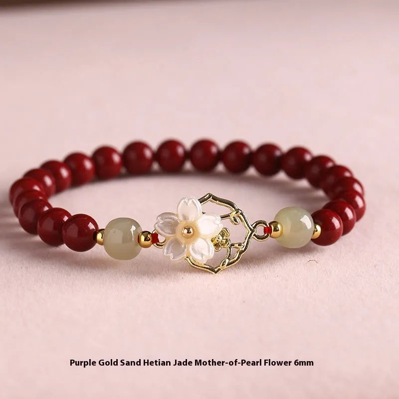 Handcrafted cinnabar bracelet with Hetian jade elements and lotus motifs in New Chinese style showing purple gold sand and emperor sandstone colour options