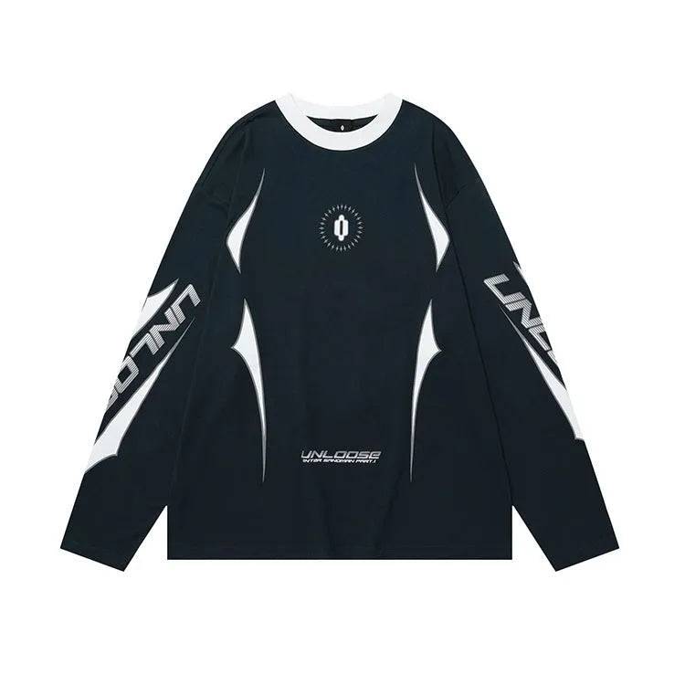 Woman wearing a grey khaki loose drop shoulder sweatshirt with a printed letter design.