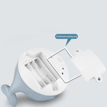 Grey or white electric whale bath toy spraying water with LED lights on a base.