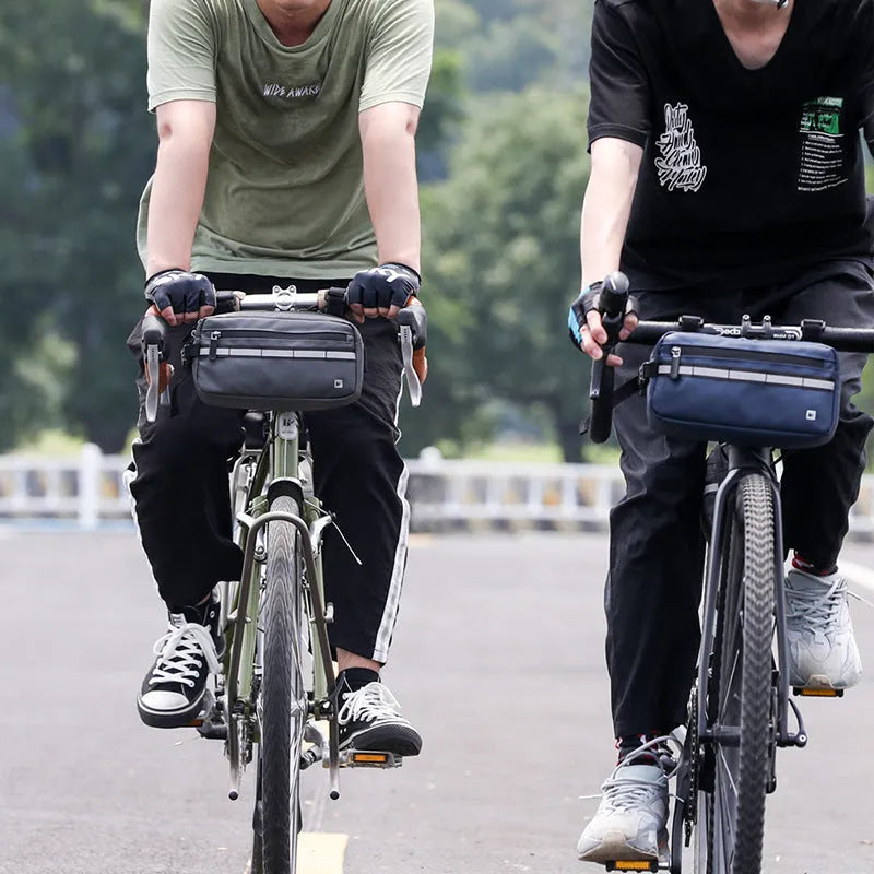 Multifunctional bicycle front handlebar bag in black, grey or blue, 1680D polyester, 3L capacity, 25cm x 8.5cm x 13cm.