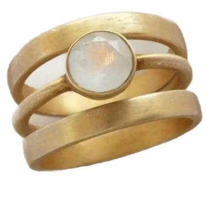 Gold-plated titanium steel ring with geometric design and micro-inlaid white chalcedony gemstone