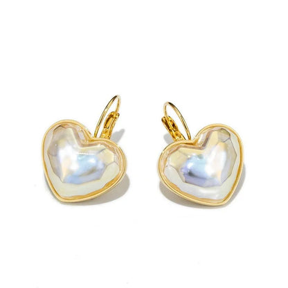 Gold-coloured alloy clip-on earring for women with a natural design.