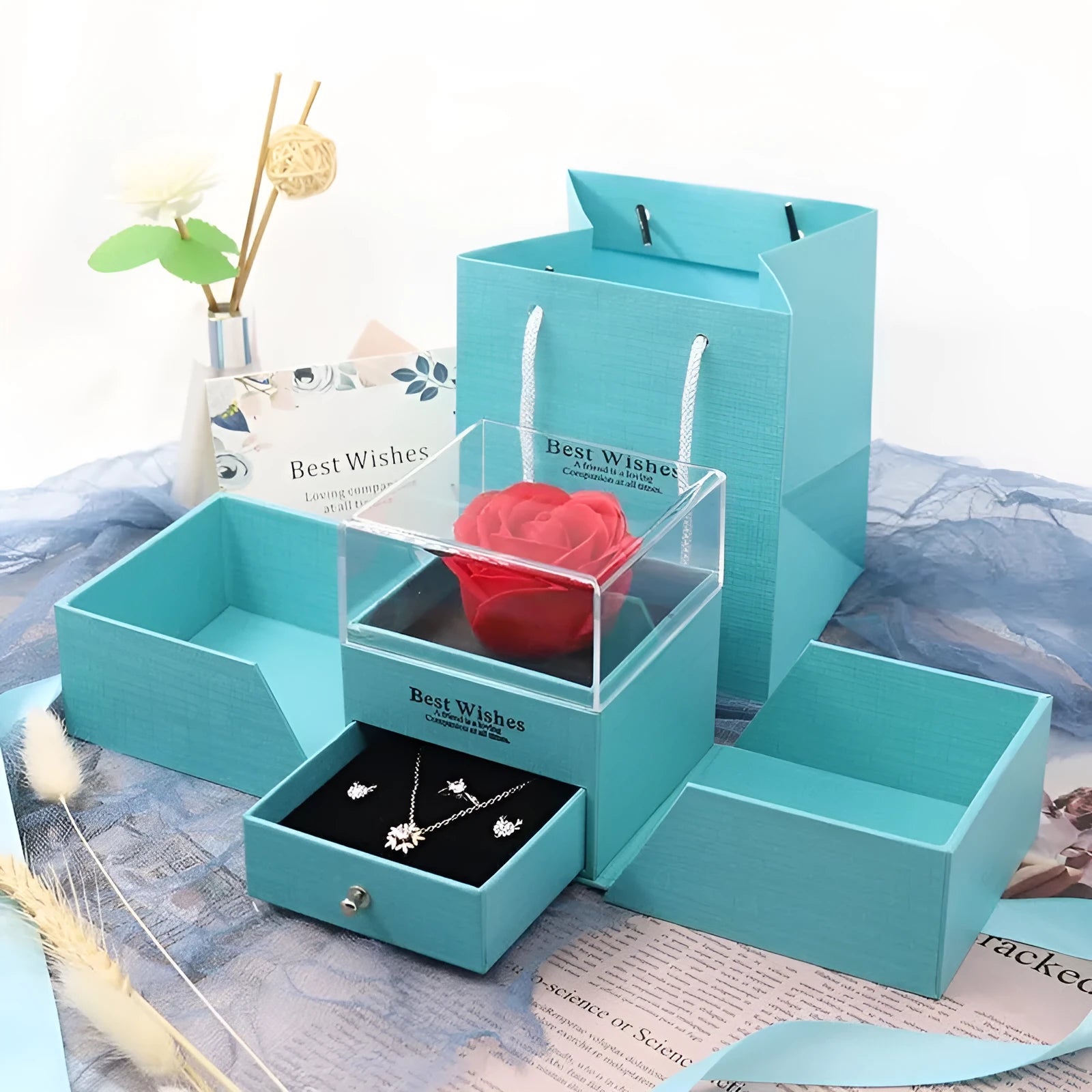 Cardboard jewellery gift box with inner packaging compartments, shown in pink colour.