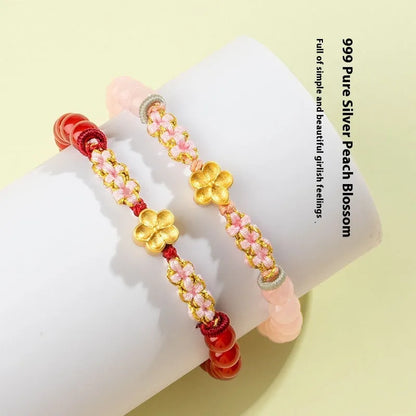 Hand-woven red rope bracelet with crystal peach blossom charm in Chinese style