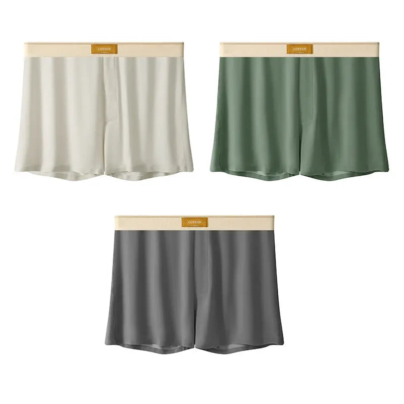 Pack of three pairs of solid colour men's ice silk briefs on a white background