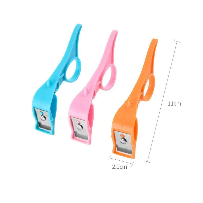 Multifunctional fruit peeler with finger ring grip and stainless steel blade in pink, blue, orange colours