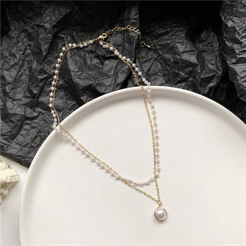 Elegant double-layer pearl necklace for women in gold, showcasing sophisticated design and high-quality craftsmanship.