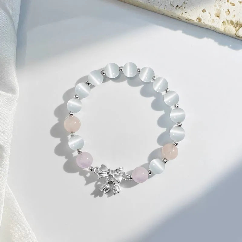 Lavender amethyst opal bracelet with crystal bowknot charm measuring 10mm