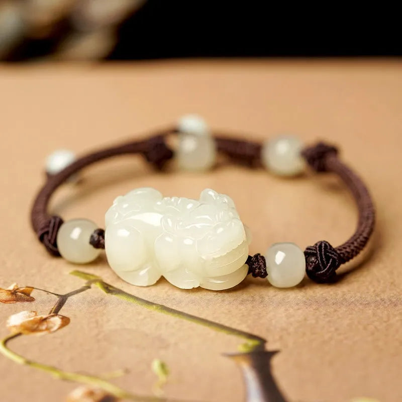Hetian jade bracelet with black and red adjustable ropes in traditional Chinese design
