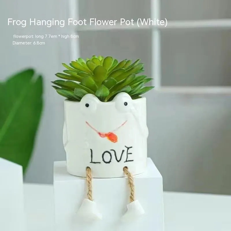 Ceramic hanging foot flowerpot with cartoon design for succulents on desktop