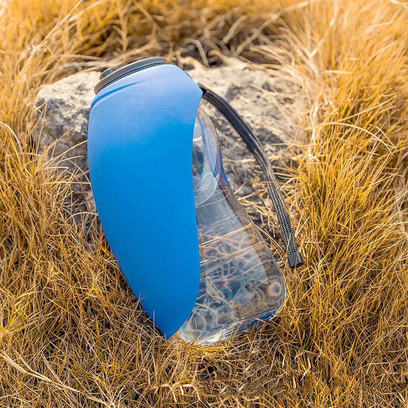 Blue portable pet water bottle with drinking bowl for dogs, showing 680ml capacity and hanging attachment