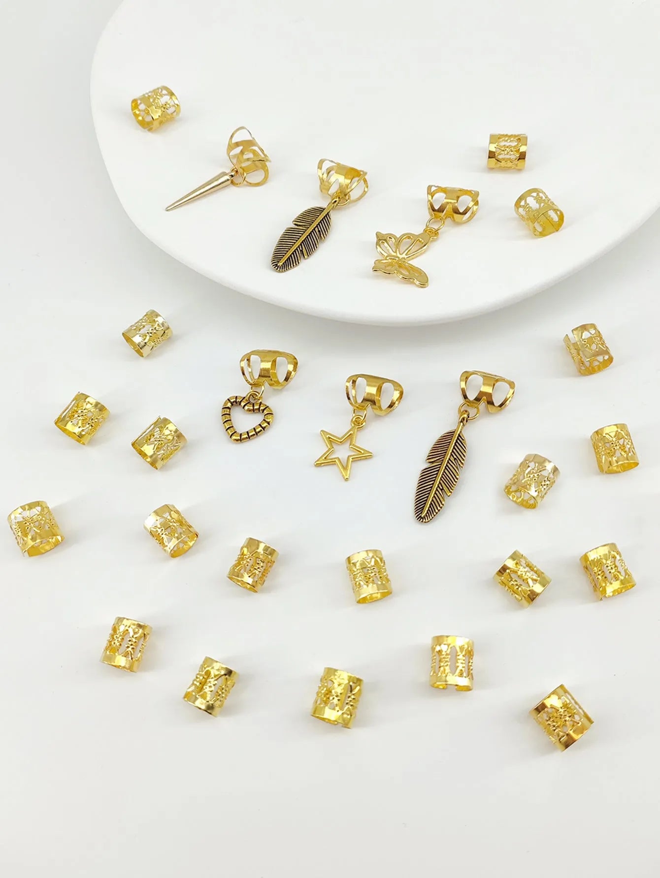 Pack of 26 antique-style dirty braid hair rings in alloy metal with gold electroplated finish.